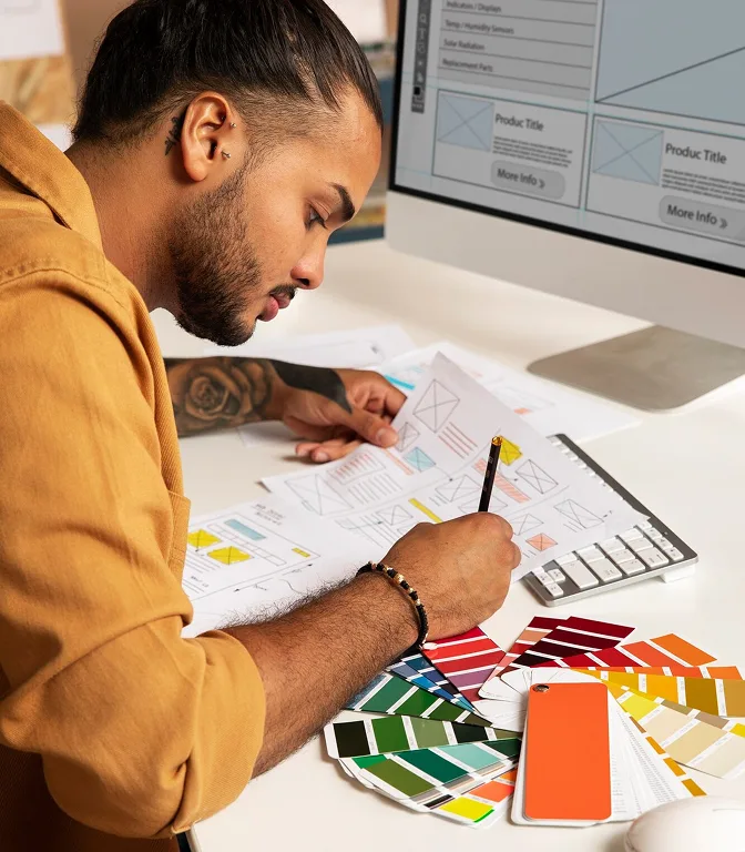 Web designer working on a startup website wireframe sketches