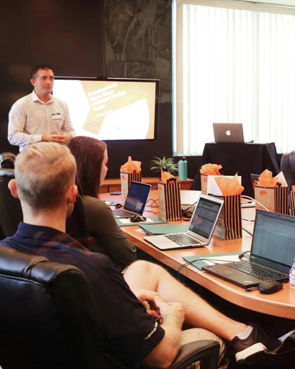 Local SEO consultant in a boardroom with a marketing team of a therapy practice in Rosebank, Johannesburg reporting on their local SEO campaign performance