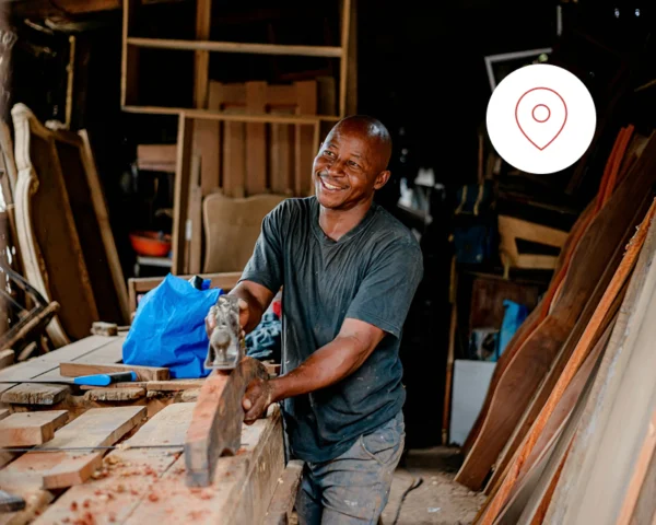 An image showing a local business owner at his carpentry workshop.